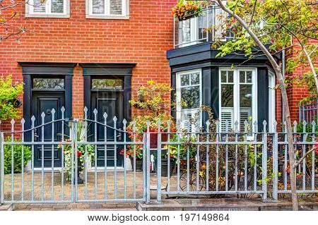 Quebec City, Canada - May 30, 2017: Closeup Of Old Town Residential Building With Gate And Door Entr