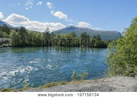 Rauma river in summer in Norwegian landscape