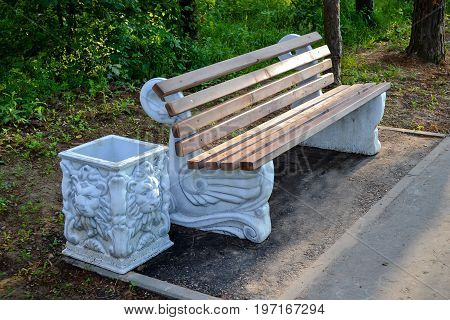Park bench with trashcan part of city infrastructure comfortable relax
