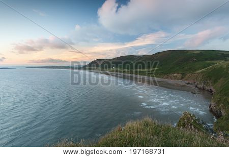 Editorial Swansea, UK - July 23, 2017: Rhossili Bay at the far tip of the Gower peninsula, showing The Old Rectory, possibly the most photographed house in Wales, UK