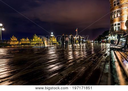 Quebec City, Canada - May 31, 2017: Old Town View Of People Walking On Dufferin Terrace At Night Wit