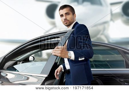 Handsome man near the car. Luxury life.