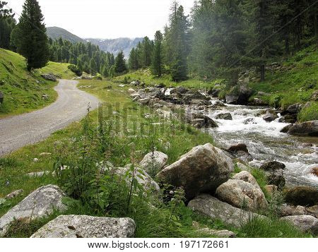 Footpath beside a stream near Scuol, Lower Engadine, Switzerland