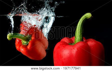 Splash Water From Water Droping Bell Pepper.