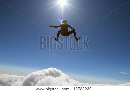 Skydiving over beautiful Norway. Clouds, sun and sky