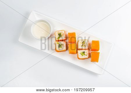 Dessert Maki Sushi - Roll With Various Fruit In Rice Pudding And Coconut Flakes