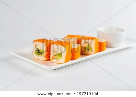 Dessert Maki Sushi - Roll With Various Fruit In Rice Pudding And Coconut Flakes