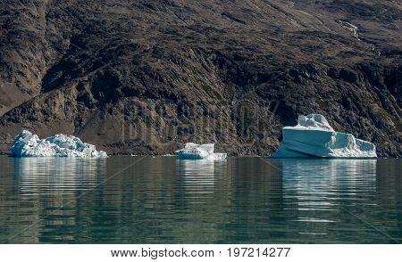 Small icebergs and reflections near the coast Greenland