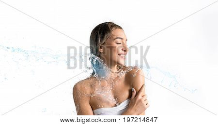 Young happy girl enjoying water stream and splashes smiling and her eyes shut