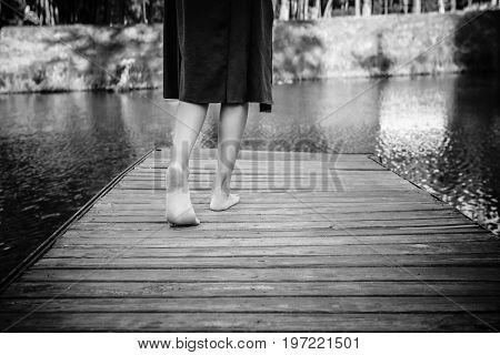 Teenager Girl Making A Step Bootlessly On The Wooden Pier And Moving Forward To The Water, New Oppor