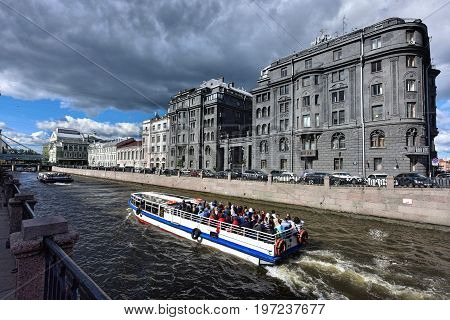 SAINT PETERSBURG/ RUSSIA - JULY 2, 2017. View of the embankment of the Krjukov canal and the Vege House (built in 1912-1914) in the foreground. Saint Petersburg, Russia.