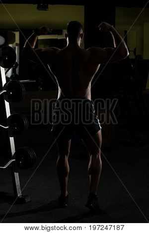 Silhouette Bodybuilder Flexing Muscles