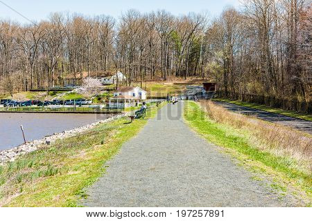 Fairfax, Virginia - April 1, 2017: Trail In Accotink Park With People Sitting On Benches In Spring B