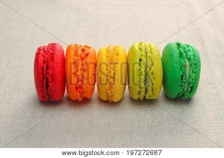 Delicious assortment of colored macaroons with a gradation of color.