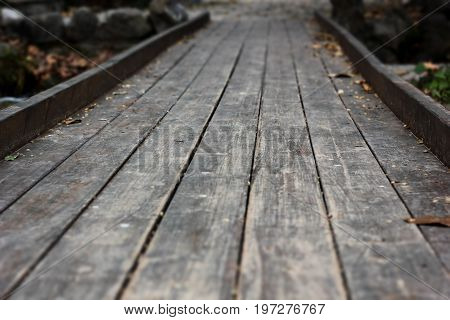 Old small bridge at the deep forest