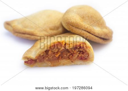 Typical spanish empanadillas or tuna small turnover. Isolated over white background