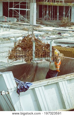 Crane Lifting Up A Load Of Steel Rebar 4