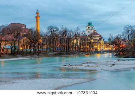View of the city embankment and the river Isar at sunset. Munich. Germany. Bavaria.