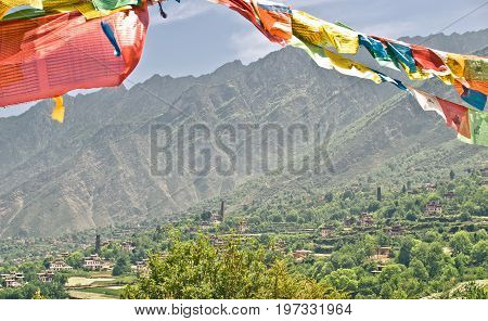 View on buddhist prayer flags in the tibetan mountain