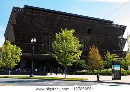 WASHINGTON, DC - JULY 12, 2017:  People lined up outside of the National Museum of African American History and Culture, a Smithsonian Institution museum, located on the National Mall.