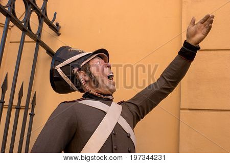 Saint Petersburg, Russia - June 17, 2017: Wax statue of a soldier in the form of a 19th-century Peter and Paul fortress. The soldiers shouted the alarm.