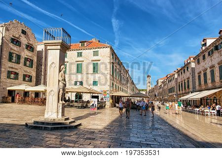 Orlando Column In Stradun Street And People Old City Dubrovnik
