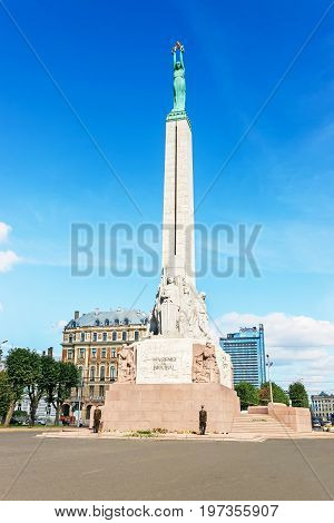 Freedom Monument And People In Old Town Of Riga Baltic