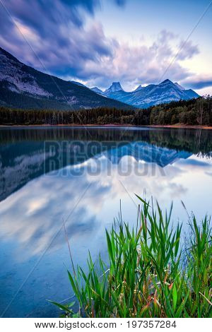 The Fortress reflected in the waters of Wedge Pond, Kananaskis, Alberta, Canada in early morning light