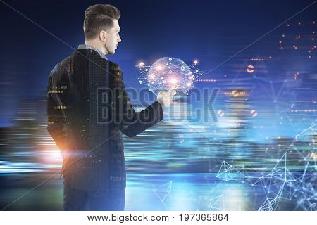 Young bearded businessman looking at his smartphone screen with a tiny Earth hologram and a network in a blurred city. Toned image double exposure mock up.