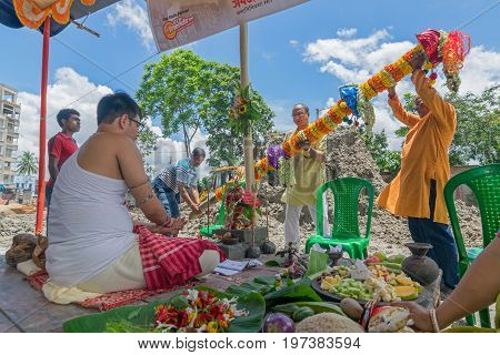 HOWRAH WEST BANGALINDIA - JULY 7TH 2017 : khutipuja the starting ritual of world famous Durga Puja (most famous festival of Hinduism) is being performed by a Hindu Priest amongst Hindu devotees.