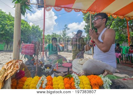HOWRAH WEST BANGALINDIA - JULY 7TH 2017 : khutipuja the starting ritual of world famous Durga Puja (most famous festival of Hinduism) is being performed by a Hindu Priest amongst Hindu devotees.