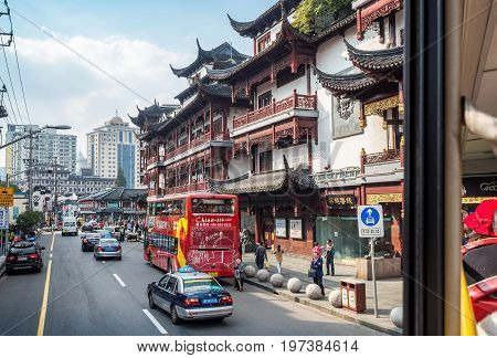 Shanghai, China - Nov 6, 2016: Fangbang Middle Road - Buildings with faithfully restored traditional Chinese architectural designs. Old Shanghai view captured from a double-decker public bus.