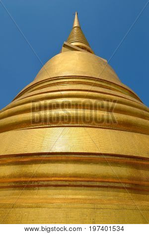 At the foot of the chedi of the Buddhist temple Wat Bovornniwet Wihan. Bangkok, Thailand