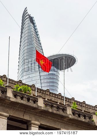 Architecture in Ho Chi Minh City with the Ho Chi Minh Branch of State Bank Of Vietnam in the foreground and Bitexco Financial Tower the third tallest building in Vietnam in the background.