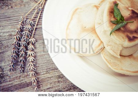 Pancakes with apples decorated with lavender and mint