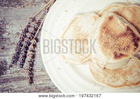 Pancakes with apples decorated with lavender and sugar