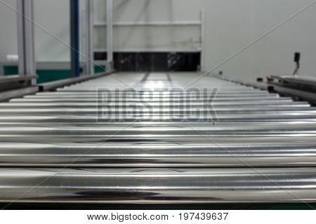 The conveyor chain and conveyor belt on production line set up in clean room area.
