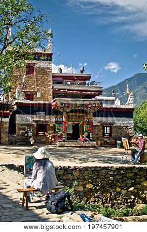 View on painter by traditional tibetan Danba village Jiaju in China
