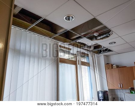 Ceiling panels damaged and collapsed by water. Rainwater leakage damage.