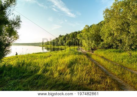 The fisherman catches a pike for spinning off the bank of the channel
