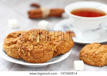 Cup Of Tea And Oatmeal Cookies With Nuts, Raisins  Cinnamon