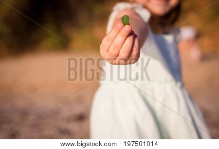 Young pretty little girl on a sand