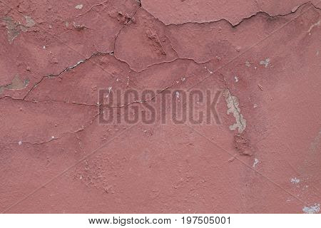 Pink wall texture with peeling paint. Grunge background for your design.