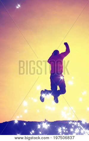 Film Grain. Flying Man. Young Man Falling Down On Colorful Sky Background.