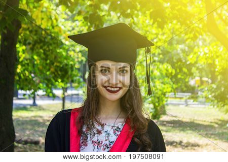 Happy woman on her graduation day. University education and happy people - concept.