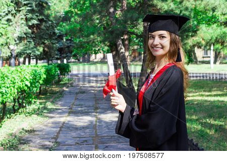 Happy woman on her graduation day. University education and happy people - concept.