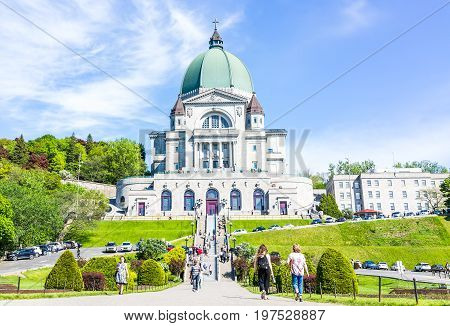 Montreal Canada - May 28 2017: St Joseph's Oratory on Mont Royal with people walking climbing steps in Quebec region city