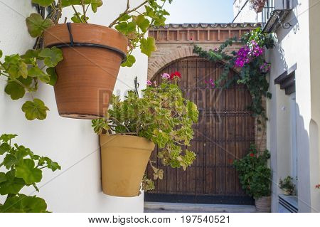 Old town street of Badajoz with flowers decorated as Al-andalus style Spain