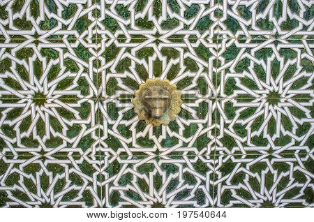 Tile arabic fountain at Old town street of Badajoz. Al-andalus decoration style Spain