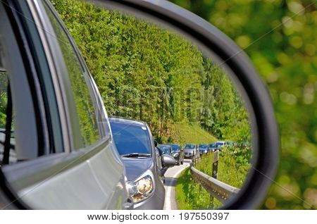 Side mirrors car behind is a traffic jam